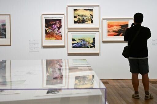A photographer takes pictures at Zao Wou-Ki exhibition