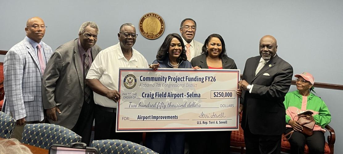 Sewell with check at Craig Field