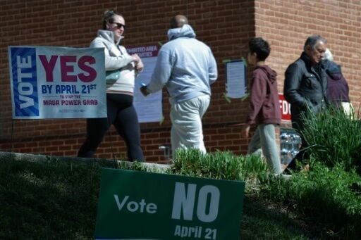 Voters arrive before casting their ballots at a polling location at the Westover Library on April 21, 2026 in Arlington, Virginia