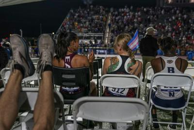 Bans on transgender athletes like sprinter Sadie Schreiner, center, are often framed as protecting women.