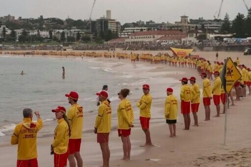 Australian lifesavers held three minutes' silence for the Bondi Beach shooting vicims