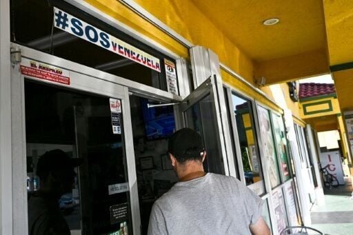A man enters a Venezuelan food mart in Doral, Florida, where 40 percent of the population is of Venezuelan origin