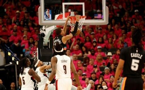 San Antonio's Victor Wembanyama dunks in the Spurs' victory over the Portland Trail Blazers in their NBA playoff opener