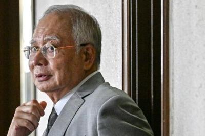 Najib says bribery, power abuse charges 'politically motivated'