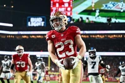 Christian McCaffrey celebrates in the end zone after a 12-yard touchdown run for the San Francisco 49ers in an NFL victory over visiting Carolina