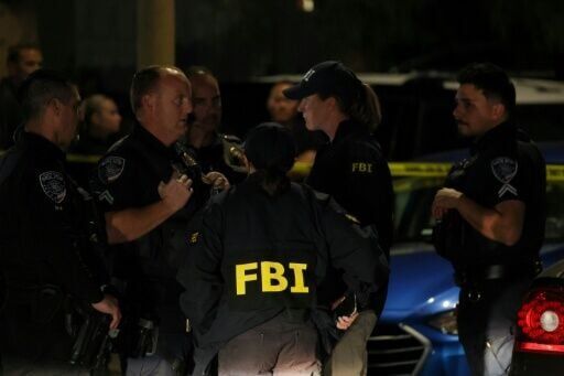 FBI agents are seen outside a residence associated with the alleged White House Correspondents' Dinner shooter in Torrance, California, on April 25, 2026