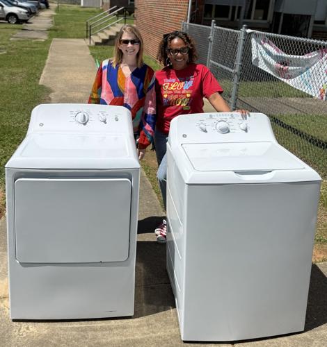 Cindy and Turner with washer dryer