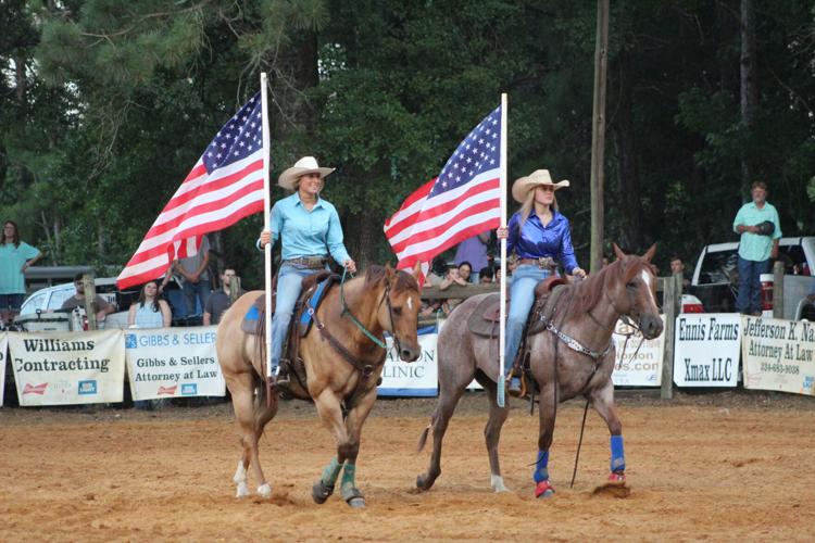 Marion Rodeo 2024 ladies with flags