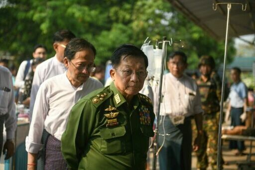 Myanmar's military chief Min Aung Hlaing (C) in Naypyidaw on March 28, 2025, after an earthquake in central Myanmar