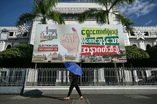 An election banner in Yangon, where polling takes place in the absence of many young voters