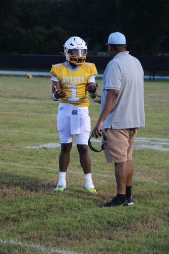 Kole Moody talking with coach