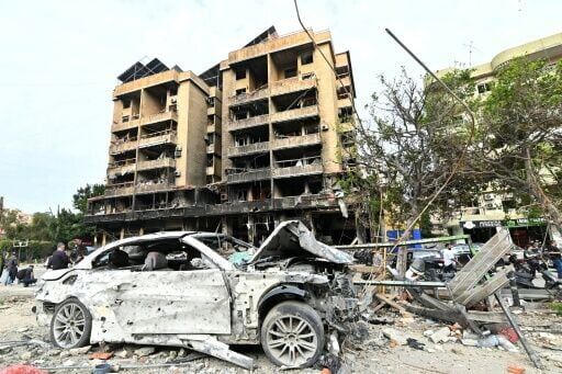 Blackened buildings and burned-out cars... scenes from Beirut's southern suburbs