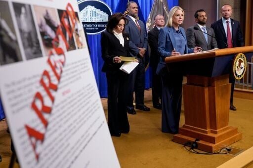 Attorney General Pam Bondi (at podium) announces the arrest of a man accused of placing pipe bombs in Washington on the eve of the January 6, 2021 assault on the US Capitol