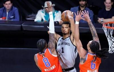 San Antonio's Victor Wembanyama towers over the Oklahoma City defense in the Spurs' NBA Cup semi-final win