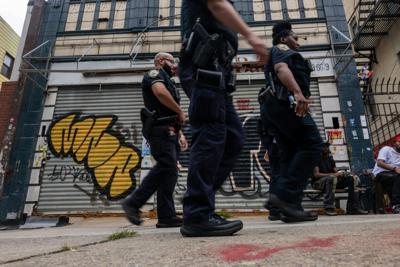 Police patrol Brooklyn’s Crown Heights in New York after a gang-related shooting in August 2025.