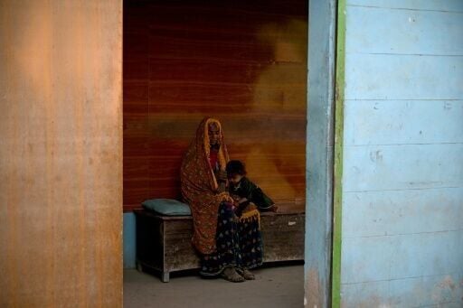 Patients await treatment in an unlicensed clinic on the outskirts of Hyderabad city in Pakistan's Sindh province