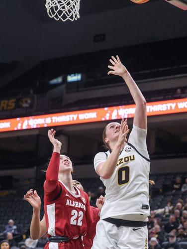Mizzou guard Grace Slaughter (0) shoots the ball next to Alabama guard Karly Weathers (22)