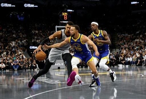 Golden State's Stephen Curry steals the ball from Victor Wembanyama of the San Antonio Spurs in the Warriors' NBA Cup victory over the Spurs