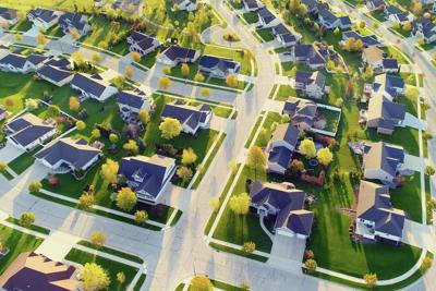 Many HOAs are designed with a uniform look, often featuring mandatory turfgrass lawns.