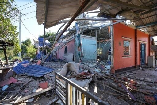 A house is damaged after Thai military strikes in Cambodia's Banteay Meanchey province, amid clashes along the Cambodia-Thailand border