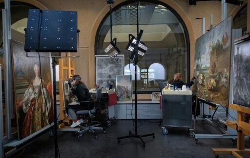 Art restorers work at the painting restoration department of the Prado museum in Madrid on October 7, 2025