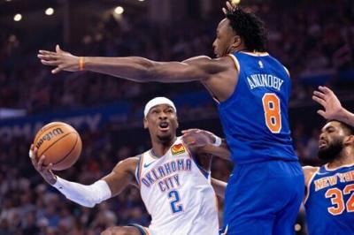 Shai Gilgeous-Alexander of the Oklahoma City Thunder shoots around New York's O.G. Anunoby in the reigning NBA champions' 111-100 home victory over the Knicks