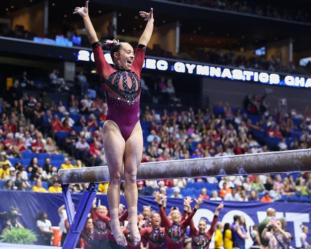 Oklahoma’s Faith Torrez celebrates after finishing her beam routine