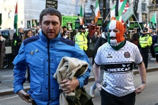 Kneecap member DJ Provai (R) and Kneecap manager Dan Lambert (L) entered court together