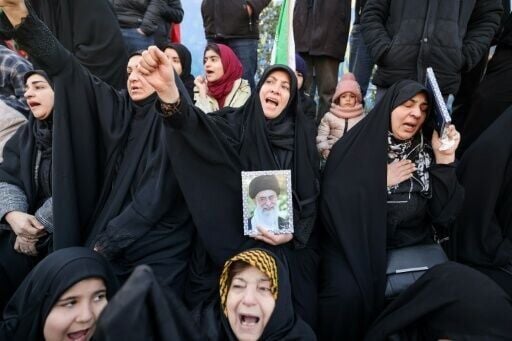 People mourn the death of Iran's supreme leader Ayatollah Ali Khamenei at a square in Tehran