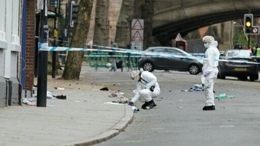 UK forensics police at work after man drove into pedestrians