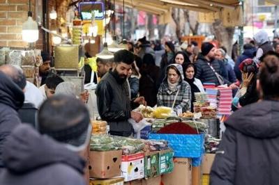 Iranians shop for food at the Grand Bazaar in the capital Tehran