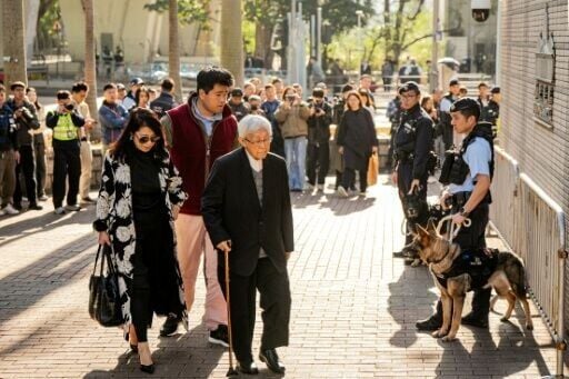 Jimmy Lai's wife Teresa (L), son Lai Shun-yan (C) and pro-democracy veteran Cardinal Joseph Zen (R) arrive at court for Lai's verdicts