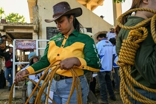 Rizza Matutino preparing to compete in the casting down event during the Rodeo Festival in Masbate