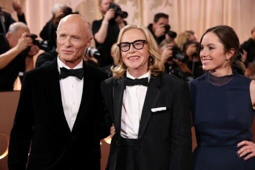 Amy Madigan (C) has been married to fellow actor Ed Harris (L) for more than 40 years; they have a daughter, Lily (R)
