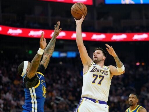 Luka Doncic shoots over Gary Payton II in the Los Angeles Lakers' drubbing of the Golden State Warriors