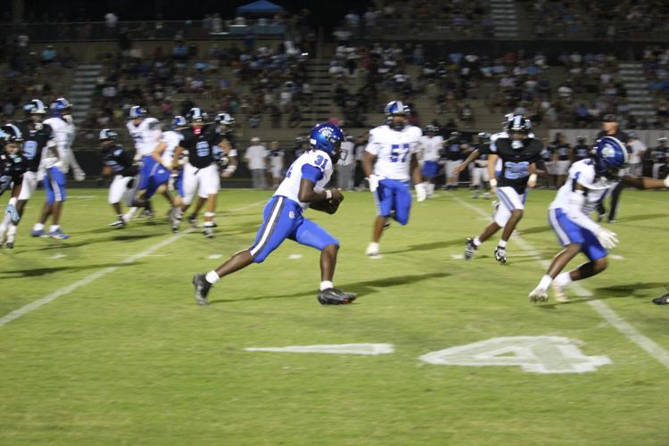 Aidan Burns runs the ball