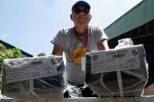 Sweltering Philippines votes with Marcos-Duterte feud centre stage