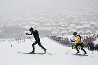 Russian Nikita Filippov (L) competing in the men's ski mountaineering sprint won the first Olympic medal for an individual neutral athlete at the Milan-Cortina Winter Games