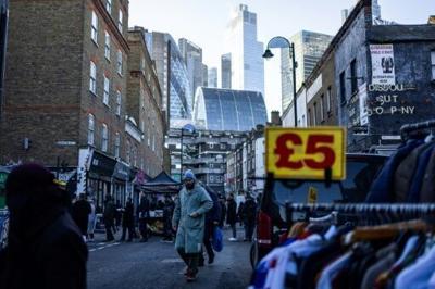 UK inflation dips, easing some pressure on government