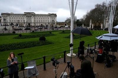 Members of the media gather outside Buckingham Palace in London after the arrest of former prince Andrew