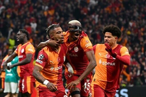Mario Lemina (L) celebrates with Victor Osimhen and Gabriel Sara after scoring for Galatasaray against Liverpool