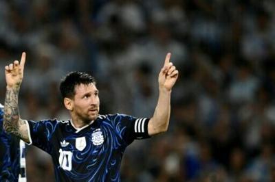 Lionel Messi celebrates scoring Argentina's second goal in a friendly victory over Zambia in Buenos Aires