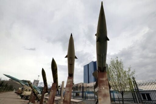 Mockups of domestically-made Iranian missiles are displayed at an exhibition outside the Defence Museum in Tehran on March 31, 2026