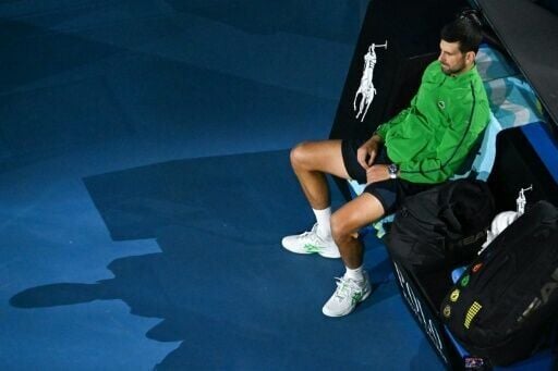 Serbia's Novak Djokovic waits for the presentation ceremony at the Australian Open