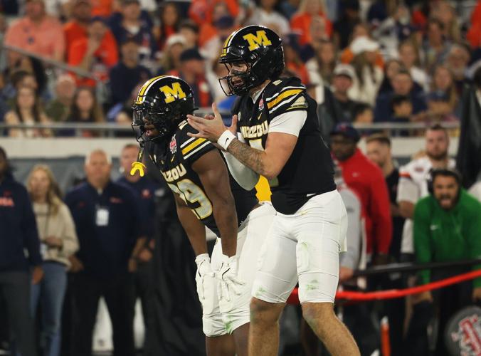 Mizzou quarterback Matt Zollers (5) claps during the first half of the TaxSlayer Gator Bowl