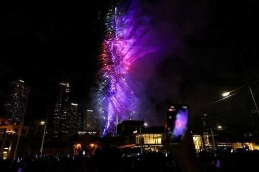 Fireworks light up the sky around the Burj Khalifa Tower in Dubai