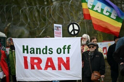 Anti-war protesters gathered with banners at an entrance to RAF Fairford in England