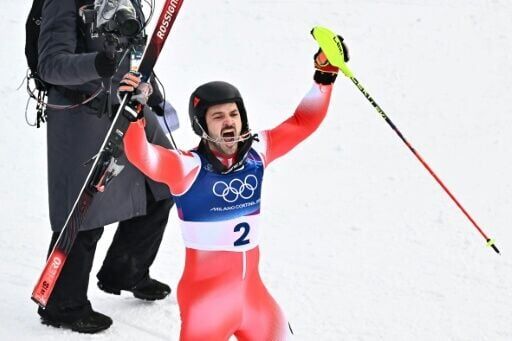 Newly crowned slalom champion Loic Meillard celebrates another Swiss men's ski gold at the Winter Olympics