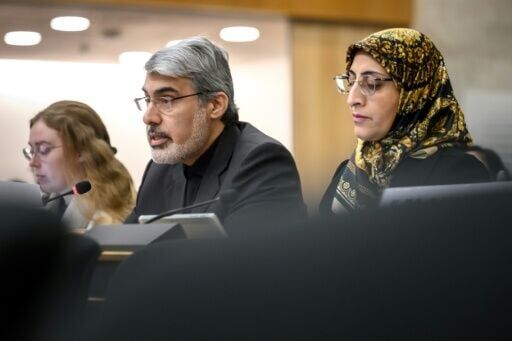 Iran's ambassador Ali Bahreini (C) told the Human Rights Council that his country was under 'reckless military aggression'