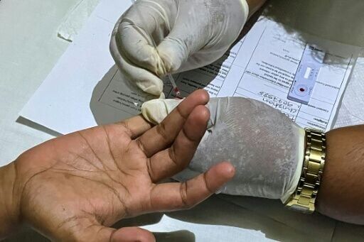 A blood test being conducted at the Medical Services Pacific mobile clinic in Suva